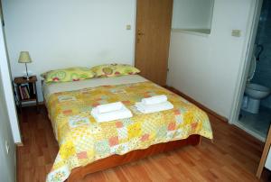 Ein Bett oder Betten in einem Zimmer der Unterkunft Marco Polo Apartments