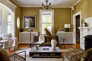 a living room with a couch and a table at AWOL Kennebunkport in Kennebunkport