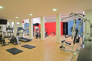 a gym with several treadmills and exercise bikes at Hotel Dann Carlton Cali in Cali