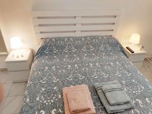Posteľ alebo postele v izbe v ubytovaní CASA SANTO a 2 minutos de la playa a pié y parking gratuito