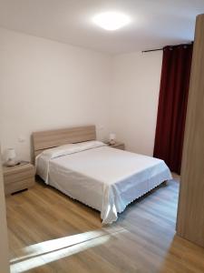 Posteľ alebo postele v izbe v ubytovaní Le camelie + 9 fotografií