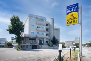 a building with a sign in front of it at Piccolo Hotel in Ravenna