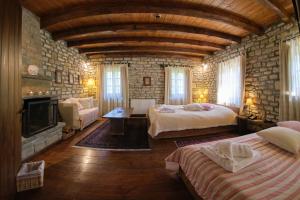 מיטה או מיטות בחדר ב-Arhontiko Aristis