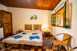 A bed or beds in a room at EcoLodge Paraty