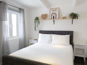 Cama o camas de una habitación en KDF Apartments