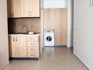 Kuchyň nebo kuchyňský kout v ubytování Apartamenti Velvet