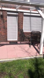Fotografie z fotogalerie ubytování Haus Annegrete mit überdachter Terrasse zum Garten v destinaci Bensersiel