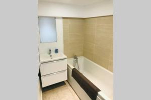 a bathroom with a tub and a sink at Le Studio 11 Abbeville centre baie de Somme in Abbeville +16 photos