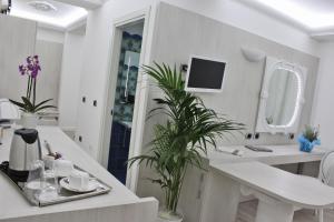 TV a/nebo společenská místnost v ubytování Boutique Hotel Paradiso Bovelacci
