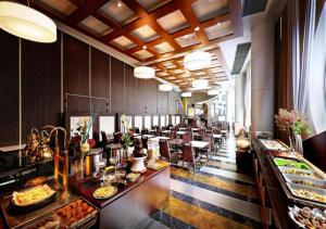 a restaurant with a buffet line with food on display at APA Hotel Kanazawa Ekimae in Kanazawa