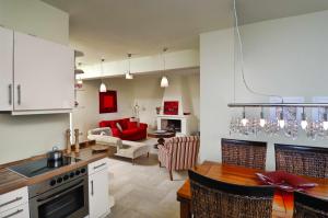 a kitchen and living room with a table and chairs at Villa Ares with private pool and a spectacular seaview 150m from the beach in Istron