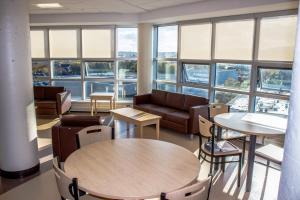 an office with tables and chairs and windows at Memorial University in St. John's