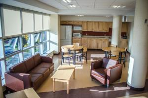 a kitchen with a couch and a table and chairs at Memorial University in St. John's