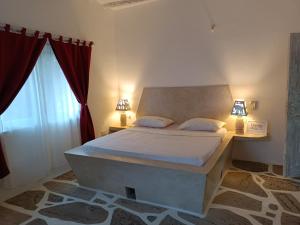 Ένα ή περισσότερα κρεβάτια σε δωμάτιο στο Neverland Watamu Villas
