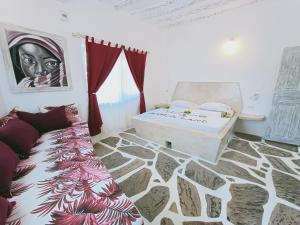 Postel nebo postele na pokoji v ubytování Watamu Neverland Villas + 24 fotografií