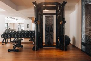 Fitness center at/o fitness facilities sa More Meni Residence & Suites