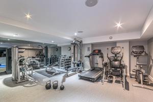 a gym with several tread machines in a room at Harbour Hotel & Spa Chichester in Chichester