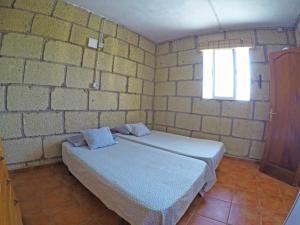 Postel nebo postele na pokoji v ubytování Finca Noya con piscina privada
