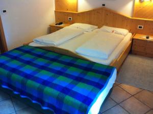 Voodi või voodid majutusasutuse Piccolo Hotel Sciliar toas