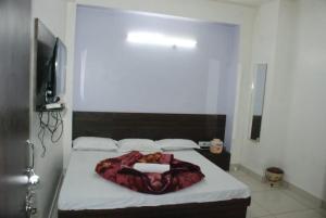 Letto o letti in una camera di Hotel Chouhan Paradise