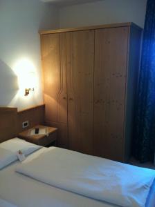 Voodi või voodid majutusasutuse Piccolo Hotel Sciliar toas