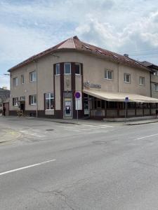 a large building on the corner of a street at Laguna ubytovanie 2 A in Trenčín