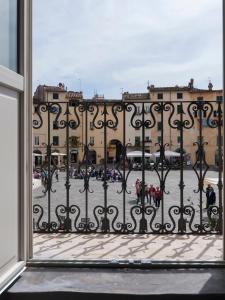 a view from a window of a building with a gate at B&B Arena di Lucca in Lucca