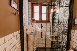 a man standing in a room in a bathroom at Galadoo Suites 3rd Floor in Istanbul