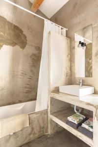 a bathroom with a sink and a bath tub at Quinta de Fermil - Casas in Vouzela