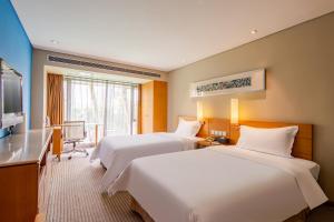 Ένα ή περισσότερα κρεβάτια σε δωμάτιο στο Gotel Capital
