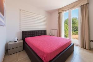Łóżko lub łóżka w pokoju w obiekcie Fani Luxury Villas
