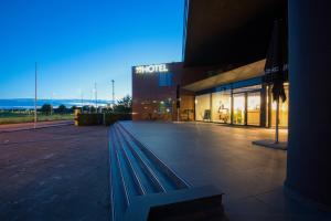 a building with a bench in front of it at NinetyNine Amsterdam Airport in Hoofddorp