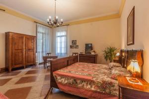 En eller flere senger på et rom på B&B Dal Viceré - Villa Mezzalira