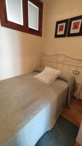 Posteľ alebo postele v izbe v ubytovaní Apartamento en primera línea de playa en Laxe