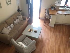a living room with a couch and a table at Exclusive Views Ronda in Ronda