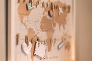 a map of the world with magnets on it at Aigli's Urban Lodge in Volos
