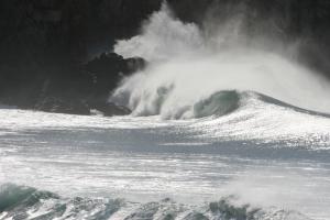 a large wave in the ocean with steam coming out at Pure Flor de Esteva in Vila do Bispo