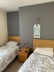 A bed or beds in a room at Wentworth Guest House 