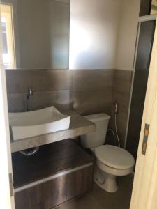 a bathroom with a sink and a toilet at Maceió Pajuçara Ed. Neo 1 in Maceió +21 photos