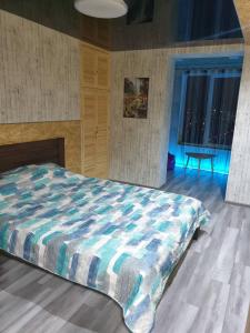 Кровать или кровати в номере Супер-Апартаменты премиум-класса с панорамным видом центр