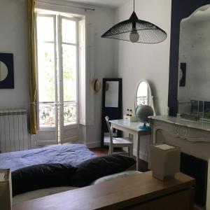 Voodi või voodid majutusasutuse Le Transvaal-Maison d'Hôtes toas