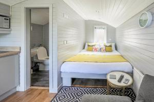 a small bedroom with a bed and a sink at Riabhach in Fort William