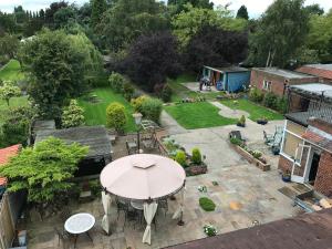 an aerial view of a patio with a table and chairs at Acorn Guest House in Hull in Hull
