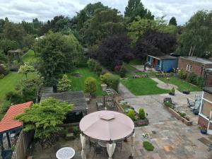an aerial view of a patio with an umbrella at Acorn Guest House in Hull in Hull