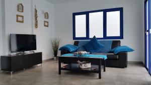a living room with a couch and a coffee table at Villa Maria in Playa Blanca