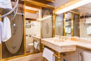a bathroom with a sink and a toilet at Spa Hotel Anglický Dvůr in Karlovy Vary +37 photos