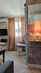a room with a bunk bed and a living room at Ático Plaza España in Jerez de la Frontera