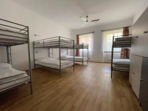 a bedroom with a bunk bed and two bunk beds at Hostel Little Quarter in Prague