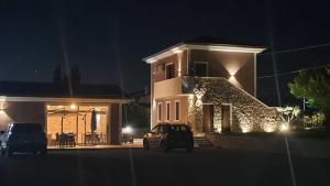a car parked in front of a house at night at Il Tufo in Montesano sulla Marcellana