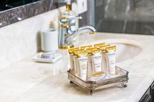 a tray of toiletries on a counter in a bathroom at Miramar By Windsor Copacabana in Rio de Janeiro